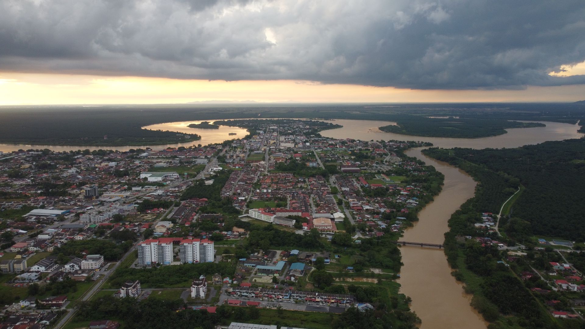 Aerial view of Teluk Intan, Perak — river bend at sunset